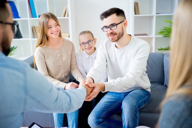 Play therapy session with a therapist, parents, and child in Hebron, TX